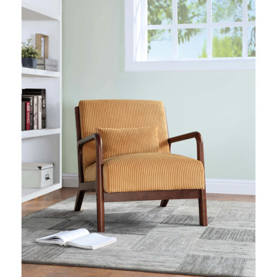 Fauteuil rembourré en velours côtelé jaune avec sensibilité scandinave, structure légèrement incurvée, soutien lombaire, convenant à un décor moderne et décoratif