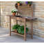 Table de rempotage d'extérieur, poste de travail en bois, tablette de rangement et évier à sec-414083468