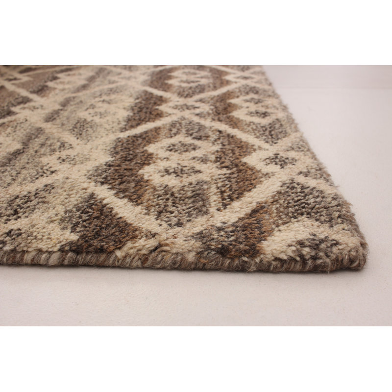 Tapis de la zone de laine brune 5 pi 1 po x 8 pi 1 po "one-of-kind" -the main noué la 2010 Grogan