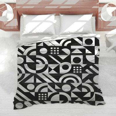 Édredon noir et blanc à motif géométrique