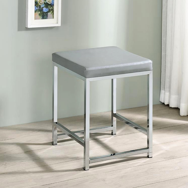 Tabouret de coiffeuse gris avec coussin carré rembourré en mousse et base en similicuir chic et contemporain