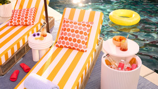 Poolside lounge chairs and cooler tables.