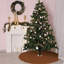 Jupe de sapin de Noël en velours brun à bord festonné, décor rustique vintage pour les fêtes de fin d'année.
