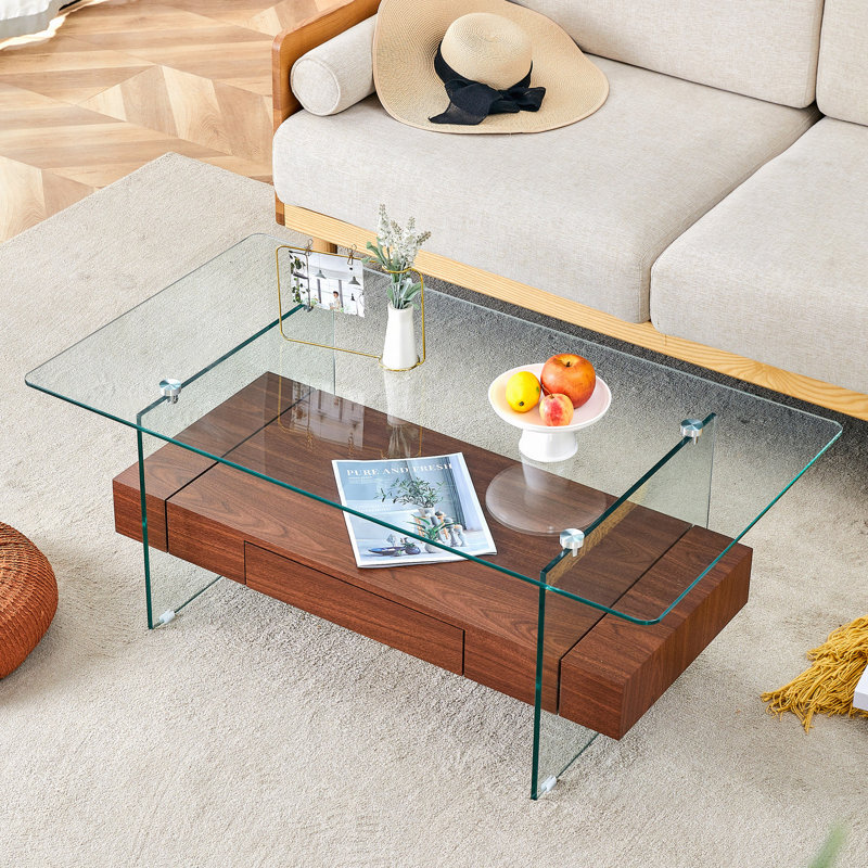 Table basse à deux niveaux de 43,3 po, verre trempé transparent et grain de bois foncé, conception de rangement multifonctionnelle. L'étage inférieur comprend un tiroir. Peut être utilisé comme table basse, table d'appoint
