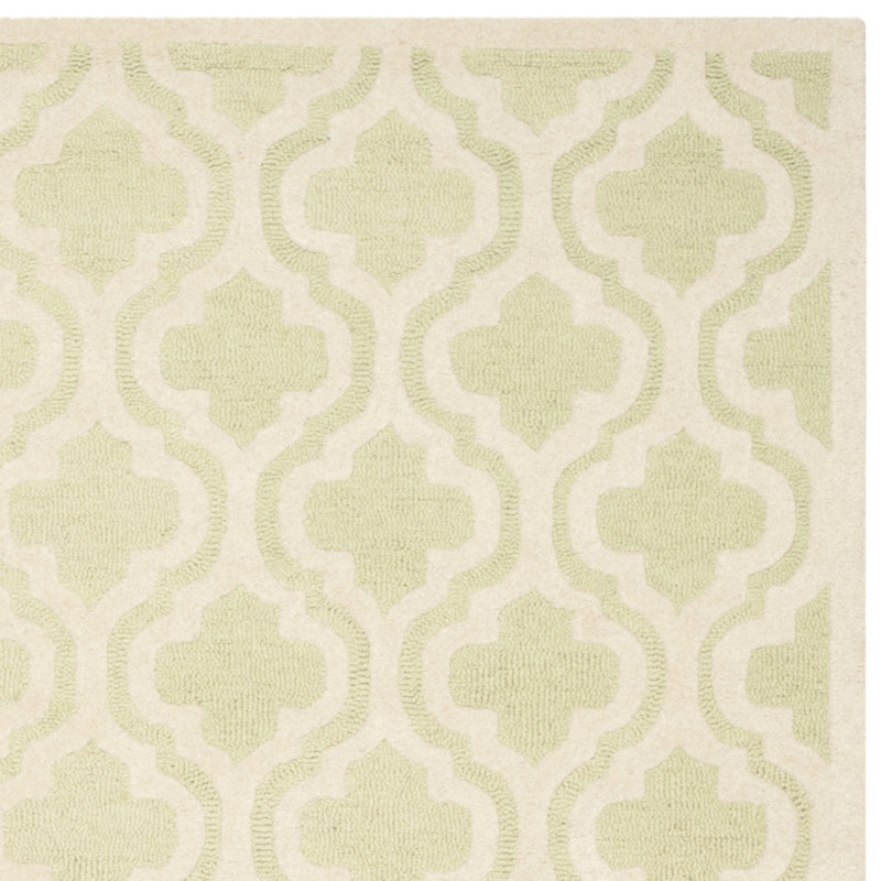 Handmade Light Green and Ivory Tufted Wool Round Rug