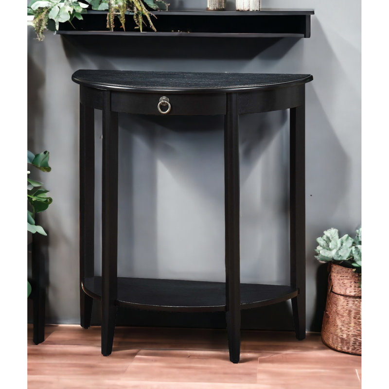 Table basse noire en demi-lune avec tablette inférieure, peu encombrante pour le salon