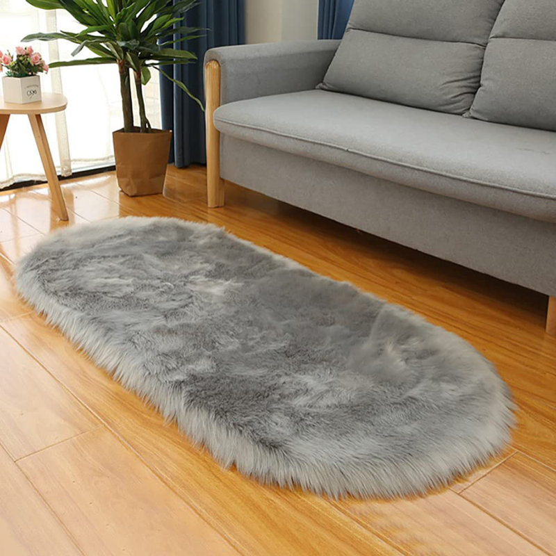 Oval Solid Colour Faux Sheepskin 120cm X 60cm Area Rug