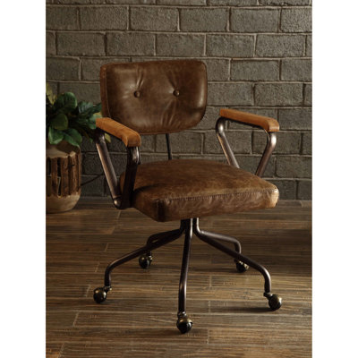 Fauteuil de bureau rétro pivotant, dossier inclinable, rembourrage en cuir pleine fleur, garniture cloutée, piètement métallique à 5 branches, profondeur d'assise 51 cm, largeur 61 cm, poids 20 kg, dossier et garniture rembourrés