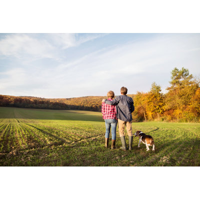 Senior Couple with Dog  Wrapped Canvas Photograph