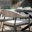 Oliveros 6 - Person Patio Dining Set with Round Table , Cushions Included