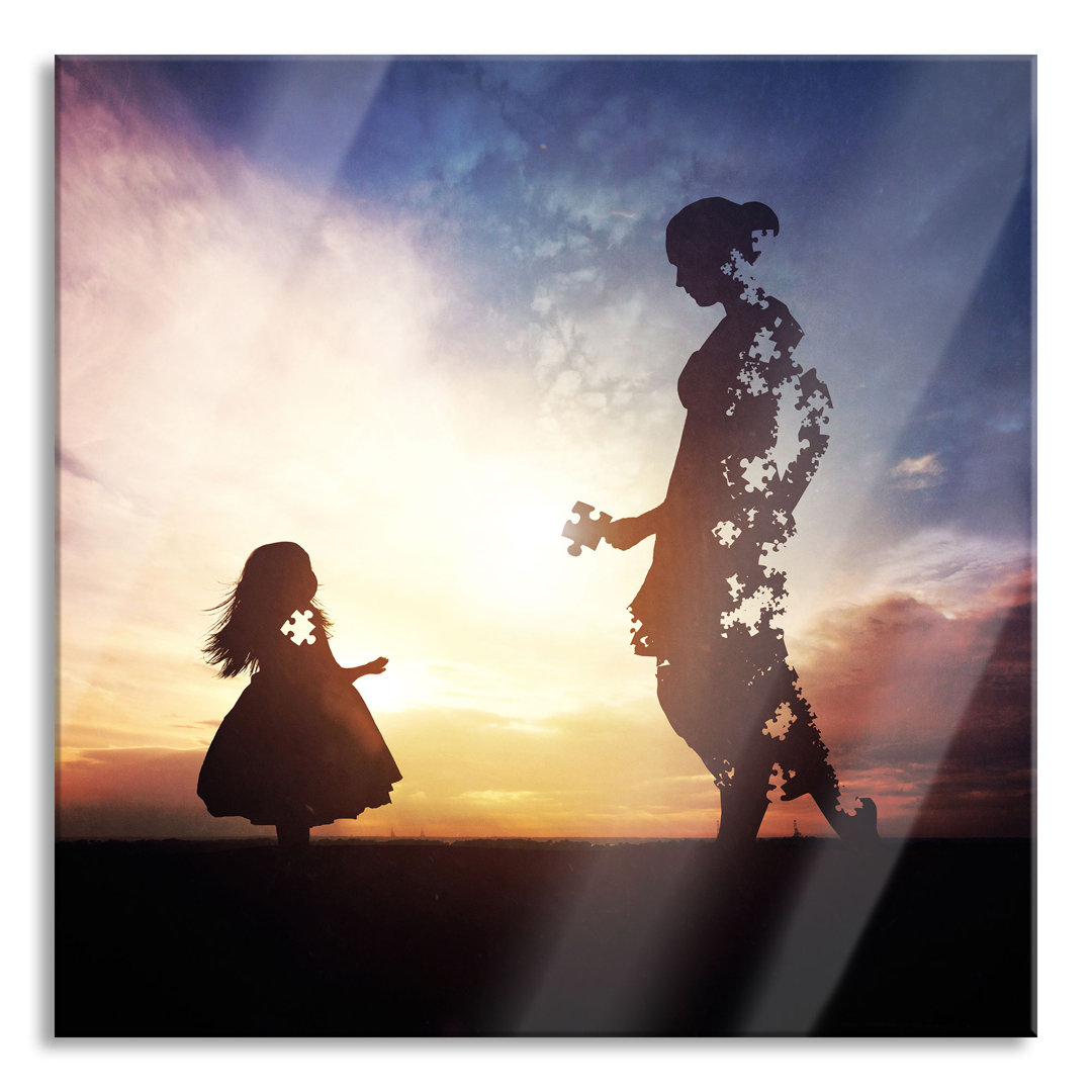 Glasbild Silhouette Puzzle Mutter und Kind