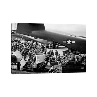 1960s Military Personnel Gathered Under Tails Of Planes In Airfield by Vintage Images - Wrapped Canvas Print