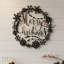 Plaque murale "Merry Christmas" en métal noir