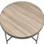 Table grise et noire de style industriel avec garniture en métal et plateau en bois