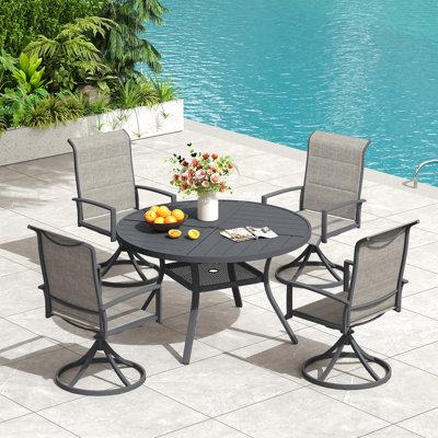 Ensemble repas pour 4 personnes avec table ronde en métal et chaises pivotantes rembourrées