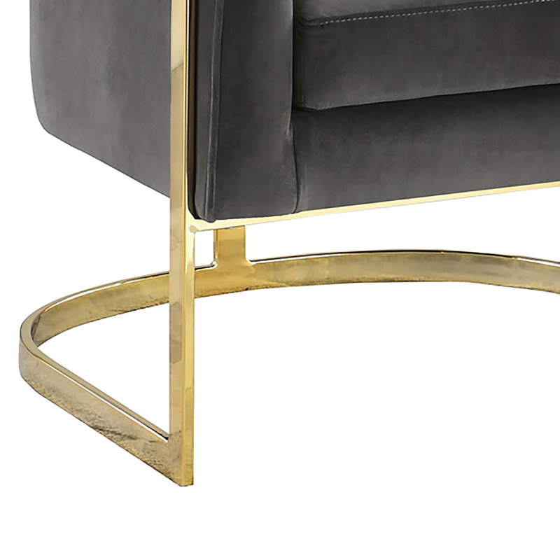 Chaise en velours gris foncé, structure élégante au design doré, caractéristique audacieuse