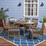 Nabil 6 - Person Acacia Wood Patio Dining Set with Oval Table , Cushions Included
