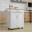 Îlot de cuisine avec chariot, tiroir, armoire de rangement et porte-serviettes