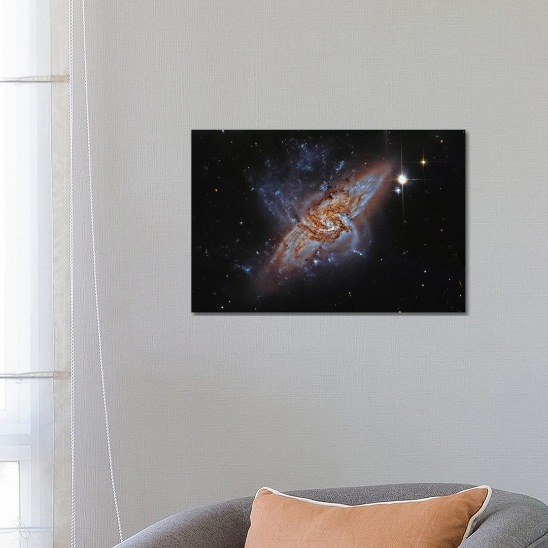 A Pair of Overlapping Spiral Galaxies (NGC 3314) by Roberto Colombari - Wrapped Canvas Photograph