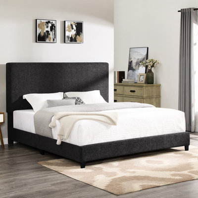 Lit très grand lit transitionnel gris anthracite avec revêtement en tissu d'ameublement foncé et pieds en bois massif