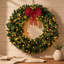 Couronne de Noël épinette 48 po pré-éclairée avec arc décoratif, 8 modes d'éclairage, baies rouges et pommes de pin