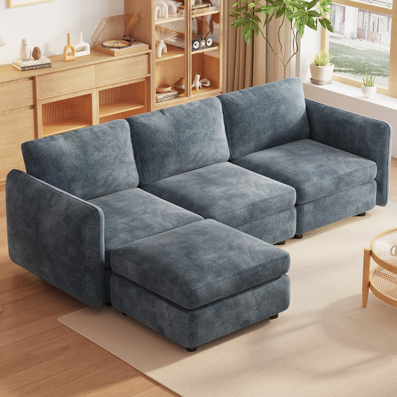 Four-Seat Blue Modular Sofa with Matching Blue Storage Ottoman