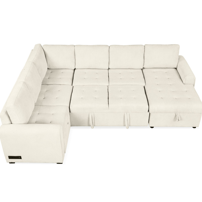 Espace de vie en forme de U beige avec lit convertible et canapé modulaire pratique avec rangement escamotable