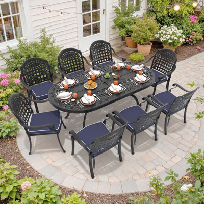 Ensemble de salle à manger d'extérieur 9 pièces, table ovale de 208 cm de long avec trou pour parasol et 8 chaises empilables avec coussins bleus