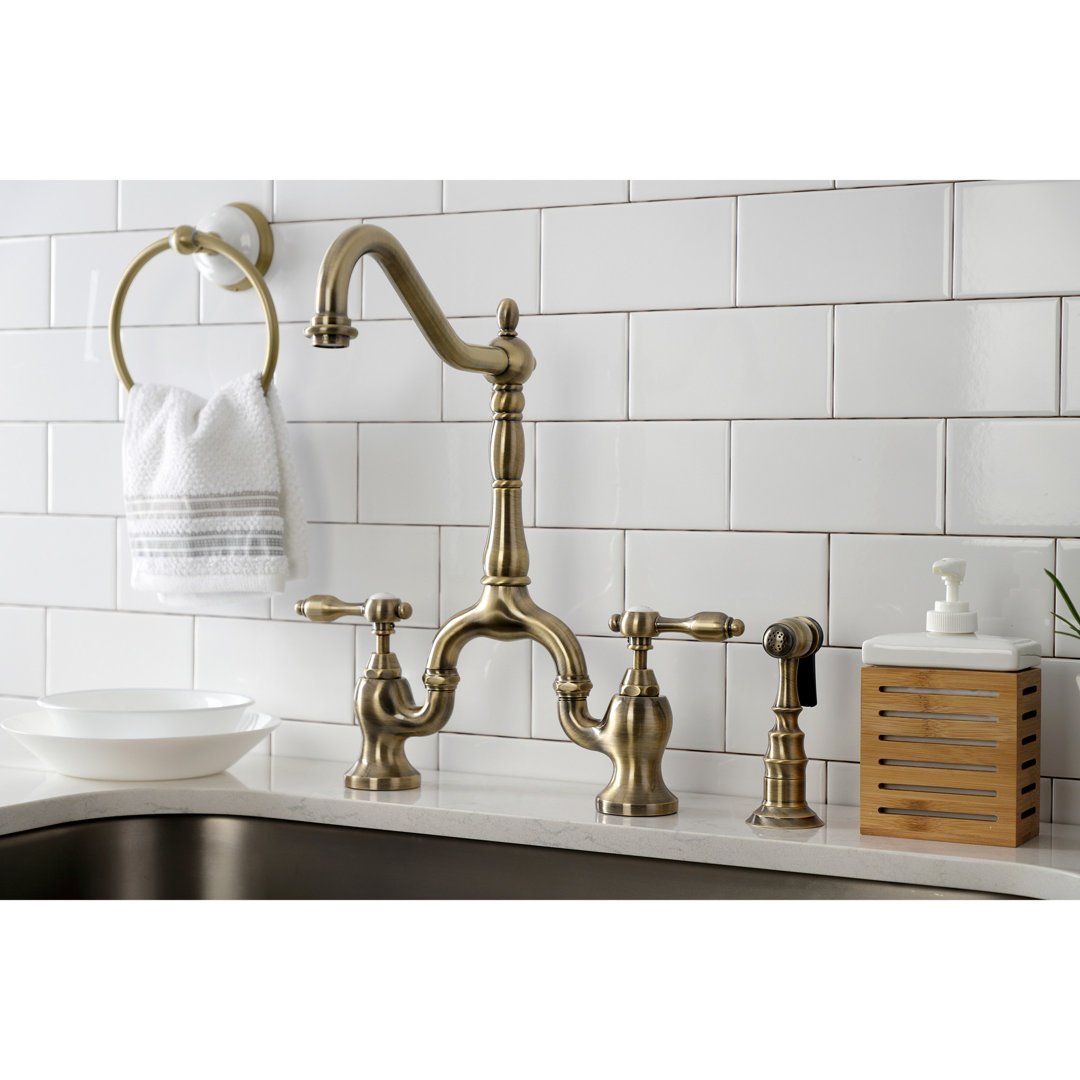 Kingston Brass Tudor Two-Handle 3-Hole Deck Mount Bridge Kitchen Faucet with Brass Side Sprayer Kingston Brass 
