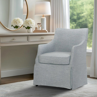 Chaise rembourrée avec accoudoirs et roulettes cachées