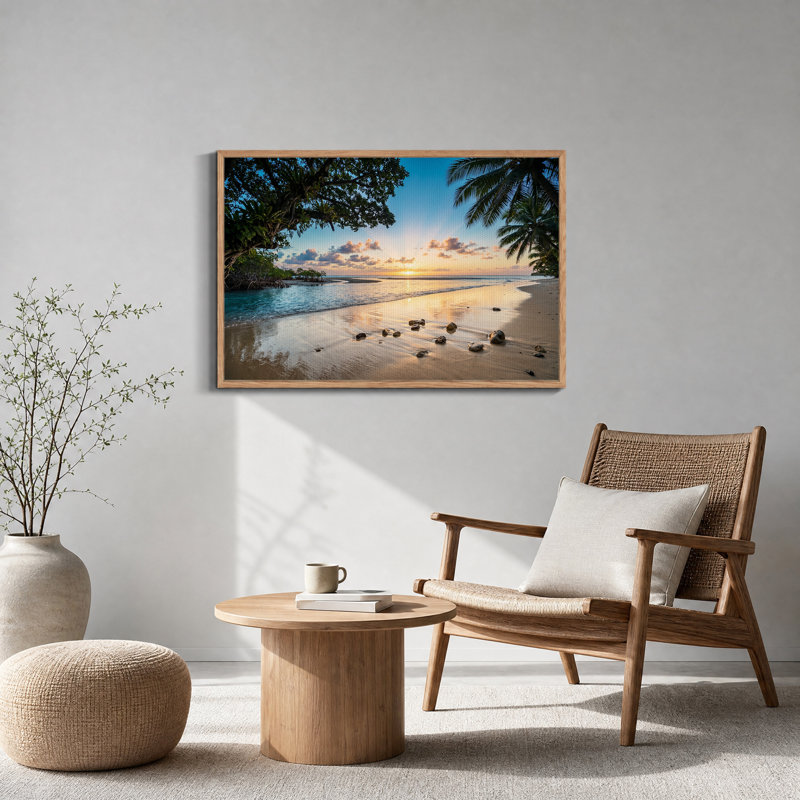 Tableau sur toile représentant un coucher de soleil tropical sur une plage avec des palmiers et des rochers