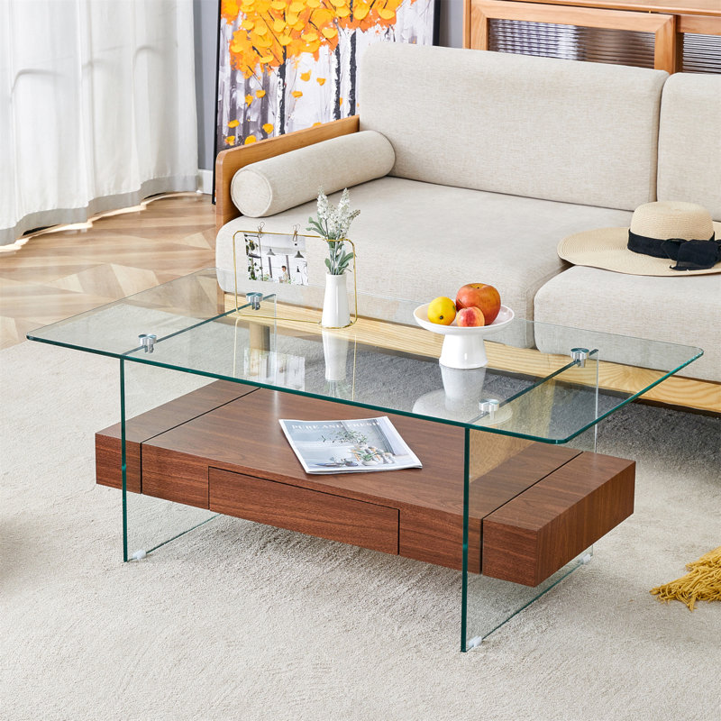 Table basse moderne à deux niveaux de 43,3 pouces - verre trempé transparent et texture grain de noyer, design de rangement multifonctionnel. L'étage inférieur comprend un tiroir. Peut être utilisé comme table basse, table d'appoint, etc.