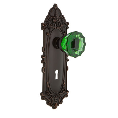 Plaque victorienne avec trou de serrure décoratif et poignée de porte en cristal émeraude