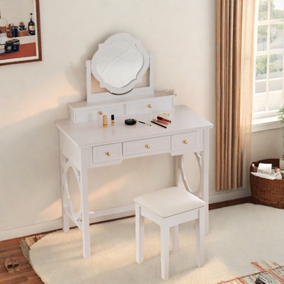 Elegant Makeup Vanity Table With Reversible Four-leaf Shaped Mirror, 5 Drawers, Golden Round Handles And A Stool by Red Barrel Studio