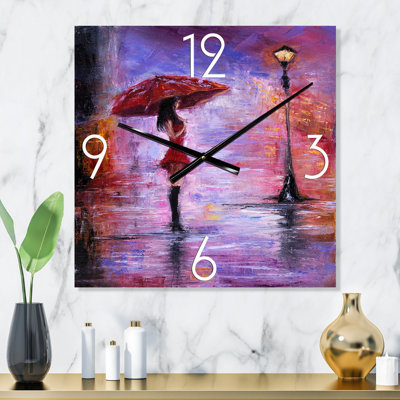 Horloge murale La femme au parapluie marchant sous la pluie I