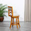 Tabouret pivotant à hauteur de bar à dossier en X, siège en tissu beige