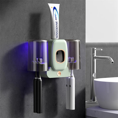 Distributeur automatique de dentifrice et porte-brosse à dents mural