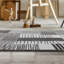 Tapis gris / noir en polypropylène tissé à la machine Cassarah-729693722