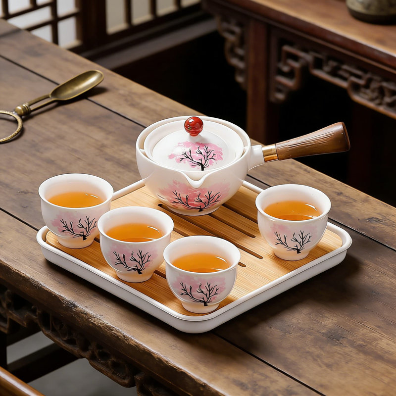 Service à thé 360 ° tournant en céramique avec sac en cuir gongfu, théière et tasses Sakura sensibles à la température, complet avec plateau à thé pour faciliter l'infusion et le voyage