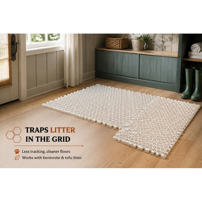 Tapis de litière extensible de type casse-tête, vendu en lot de 4, mesurant 25,2 x 25,2 pouces une fois assemblé et composé de sections de 12,6 pouces ; les pièces alvéolées retenant la litière sont fabriquées en EVA imperméable, faciles à nettoyer et peuvent être découpées sur mesure.