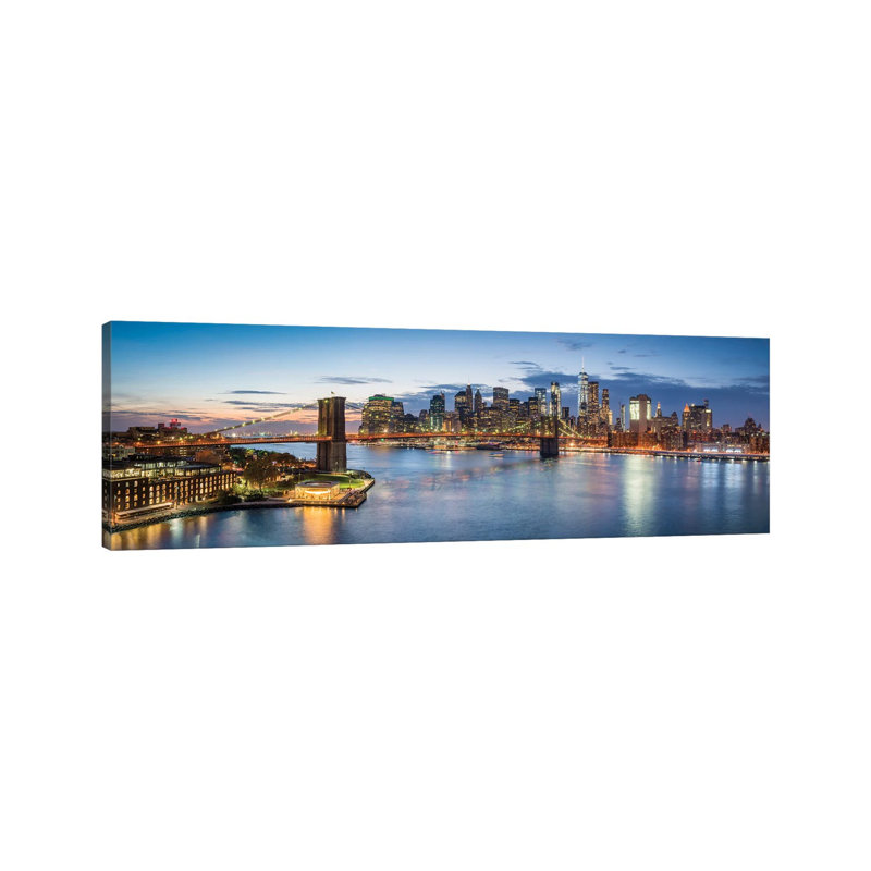 Elevated View Of The Manhattan Skyline With Brooklyn Bridge by Jan Becke - Wrapped Canvas Panoramic Print
