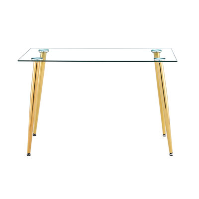 Table moderne à pieds dorés avec un plateau en verre transparent pour les pieds en métal