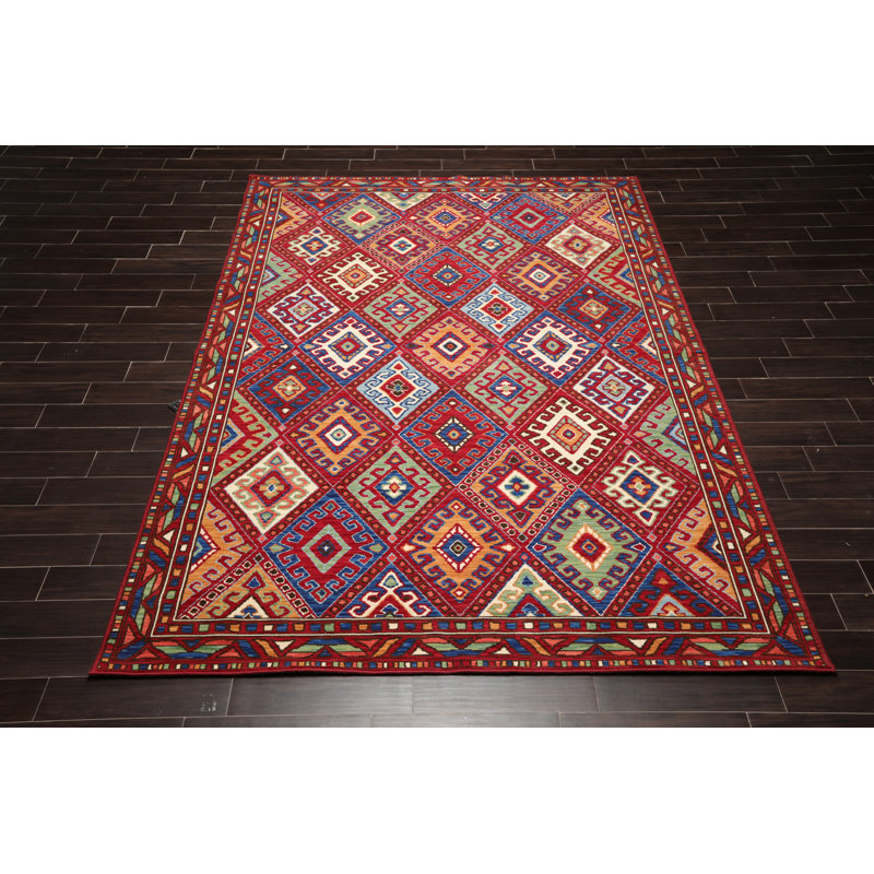Tapis rouge géométrique en laine bouclé