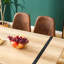 Table moderne avec plateau texturé spécial et structure robuste de salle à manger contemporaine avec pieds en métal noir-484550995