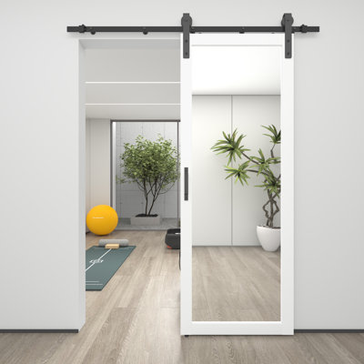 Porte de grange coulissante à miroir en bois massif avec design moderne et quincaillerie incluse