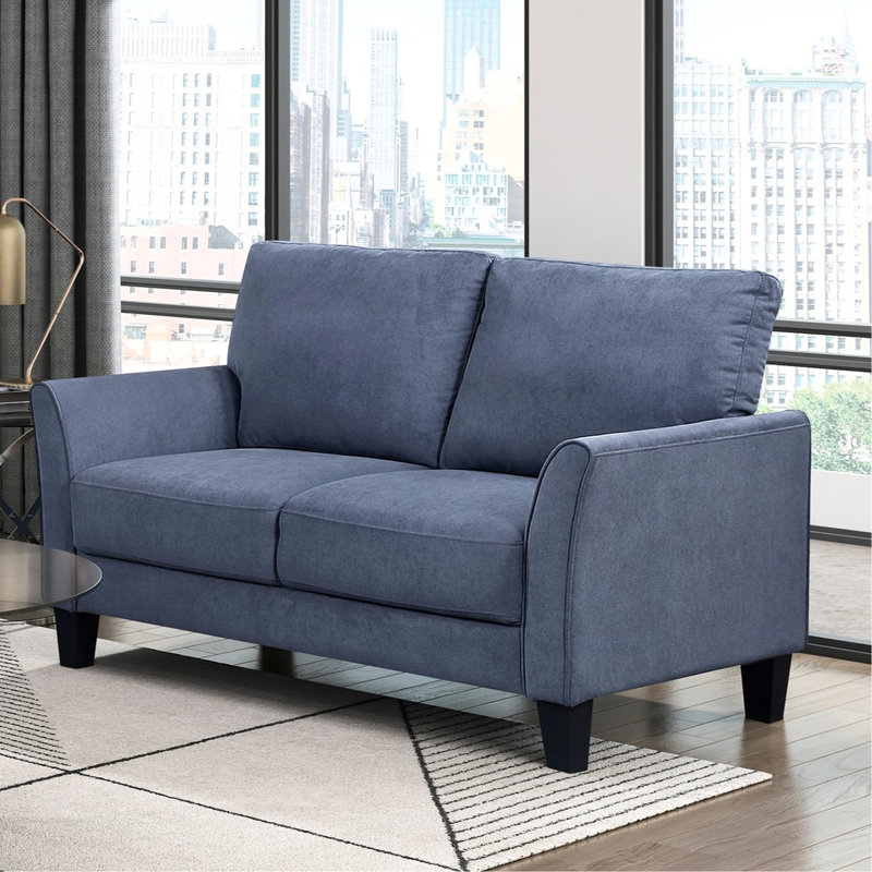 Bleu moderne moderne avec accoudoirs légèrement évasés et rembourrage en tissu à haute densité de faux bois noir