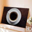 Toile vue de haut en bas d'une tasse d'art murale simple et élégante remplie de café brun foncé avec des bulles subtiles sur toile-207401974