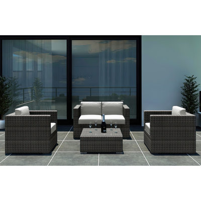 Suffern 4 Piece Rattan Sunbrella Sofa Seating Group with Cushions -  Wade Logan®, 76B049AD1AB1419CAFFD306523CE0B2A