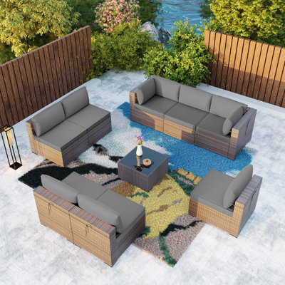 Ensemble de conversation modulaire en rotin 9 pièces avec coussins et table en verre trempé Yasmina