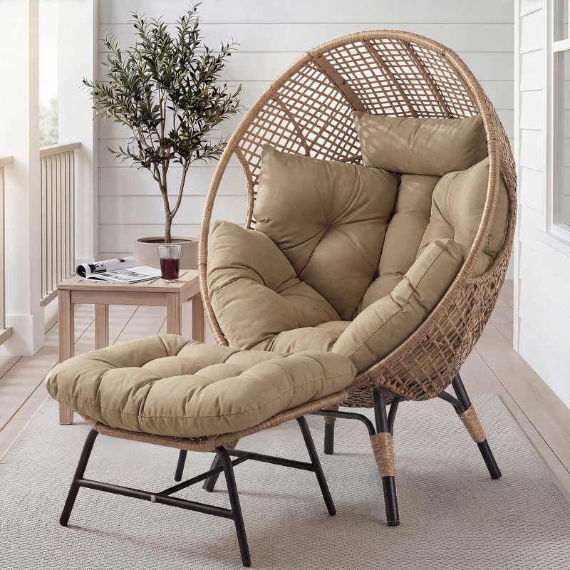 Fauteuil ovale en osier avec repose-pieds et coussins Benone, Brun / brun